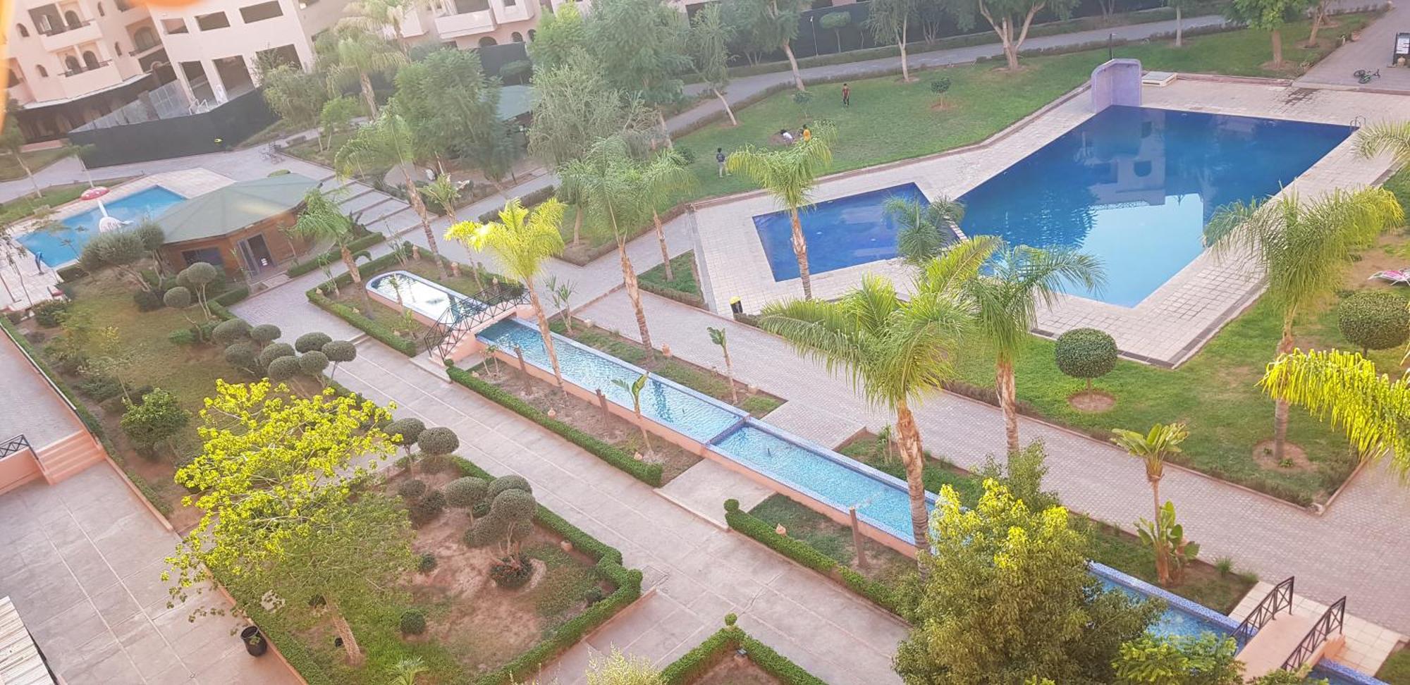 Un Moderne Chic Appartement Vue Sur Piscine Marrakesh Buitenkant foto
