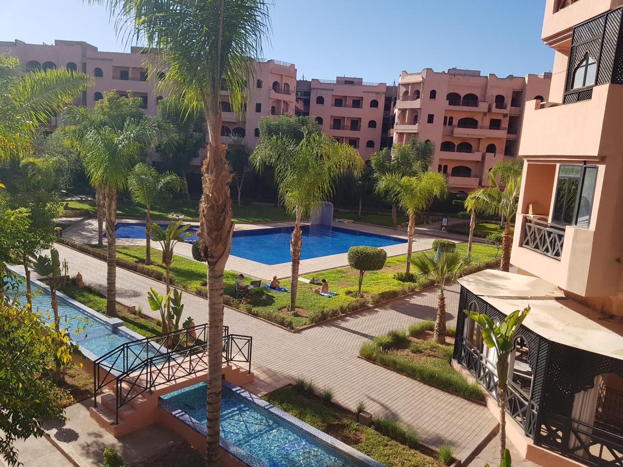Un Moderne Chic Appartement Vue Sur Piscine Marrakesh Buitenkant foto